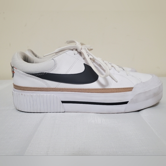 Nike Shoes - Nike Women’s White Low-Top Sneakers with Black Swoosh